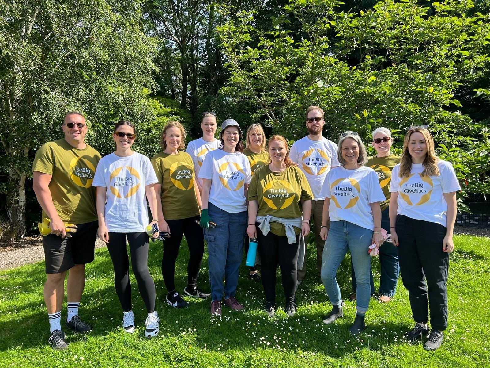 Group of volunteers wearing big give back t shirts