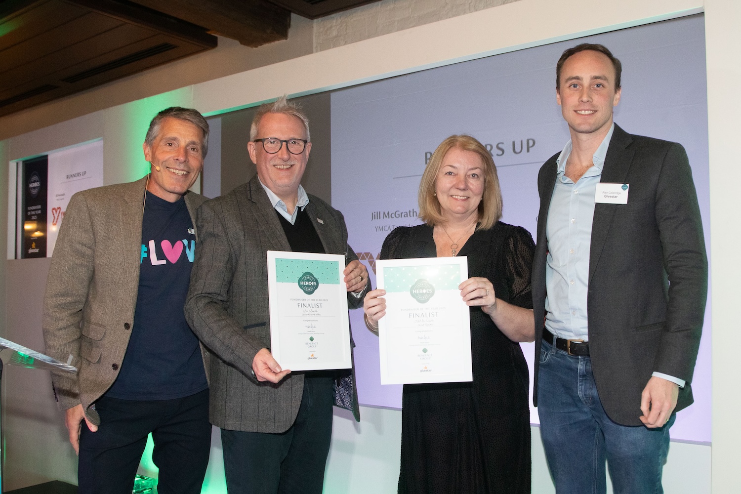 Jill McGrath, YMCA Tayside and Nic Clarke, Cancer Research Wales receiving their charity heroes award