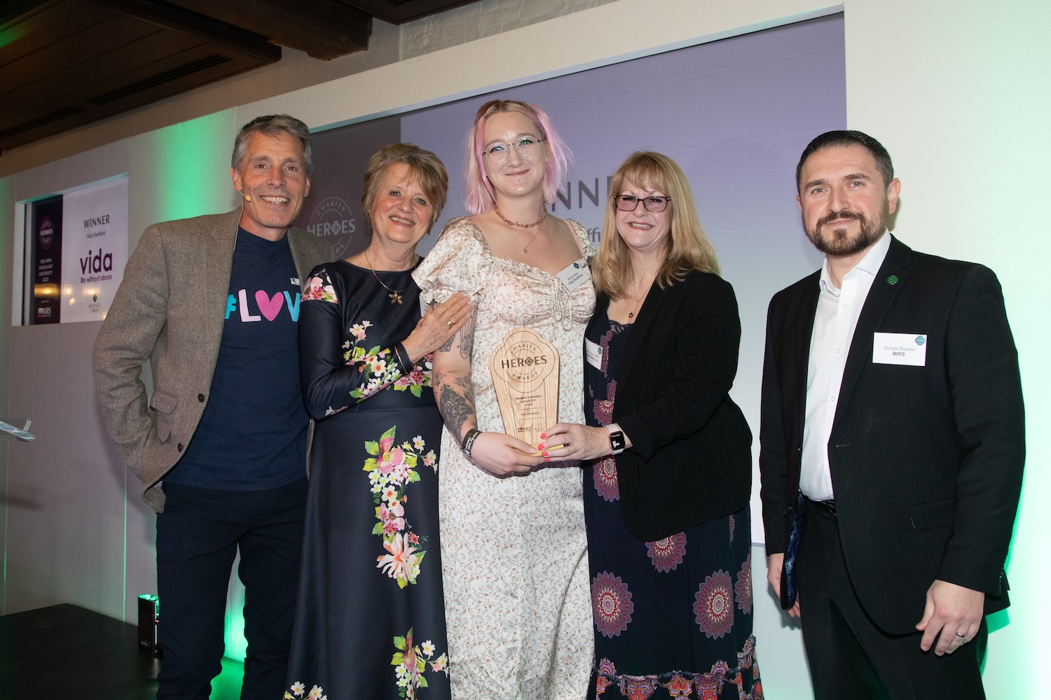Vida Sheffield receiving their charity heroes award