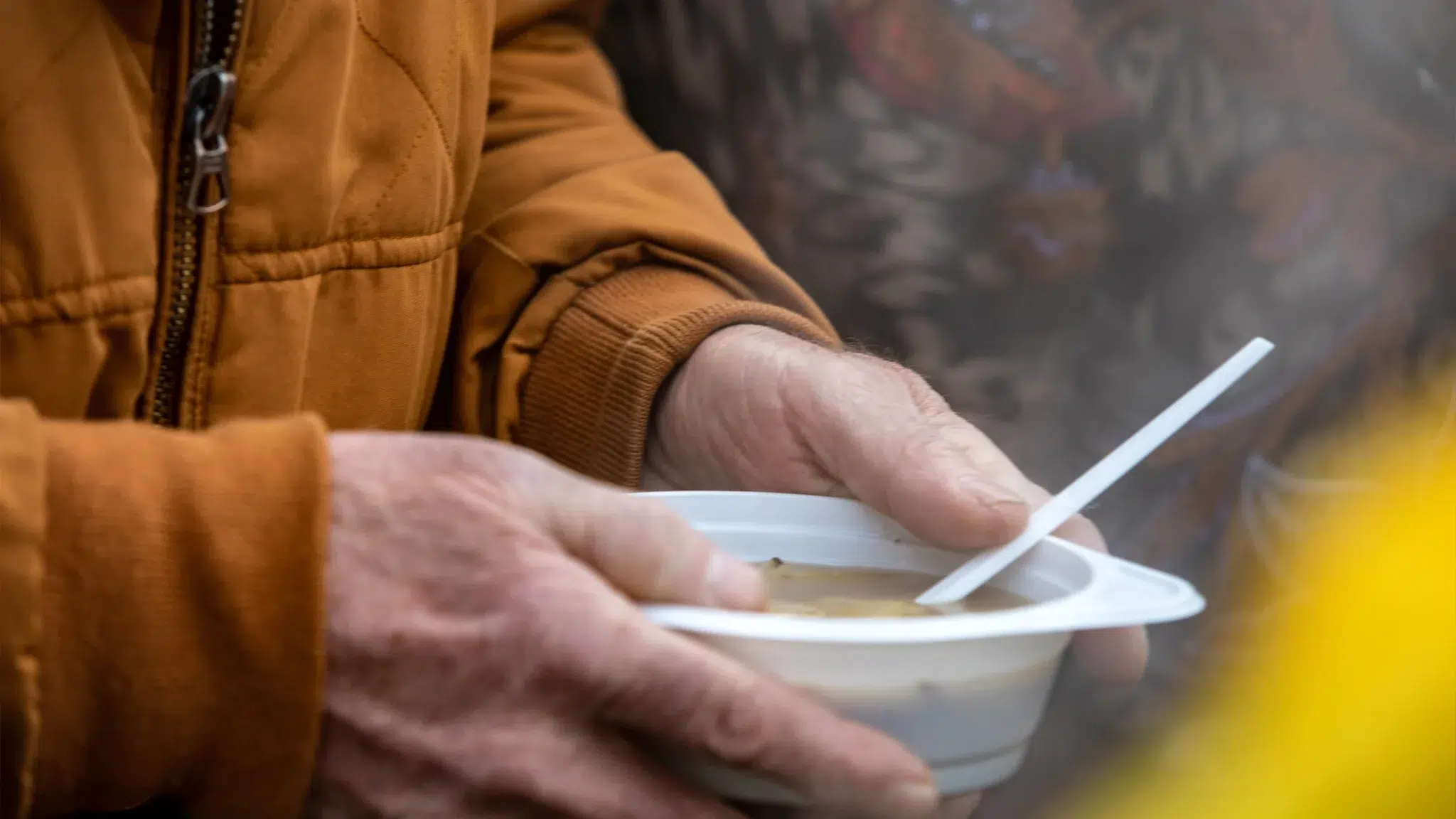 hands holding soup