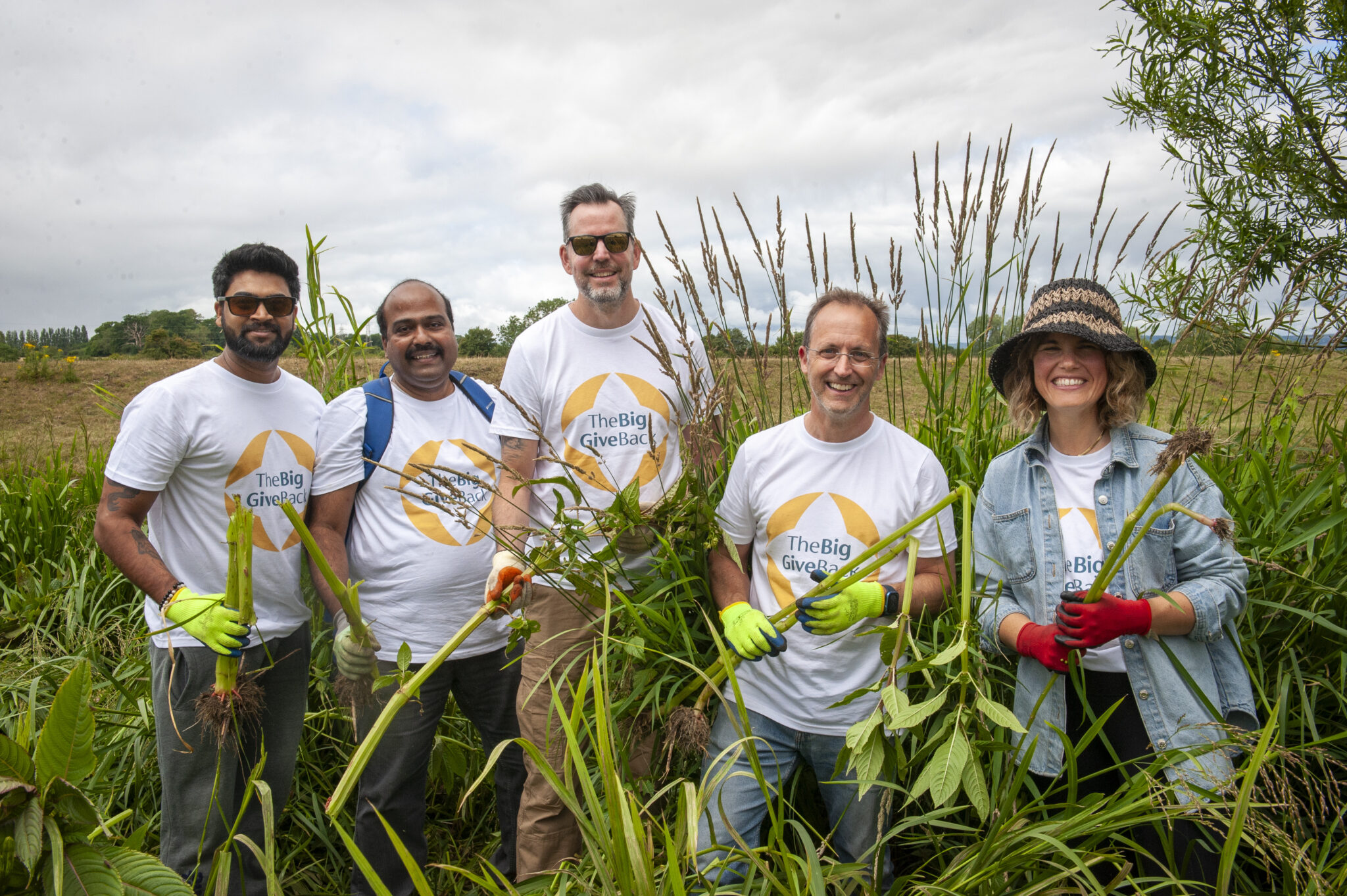 Team of volunteers looking at the camera smiling